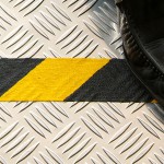 Black Yellow hazard conformable on chequer plate with show